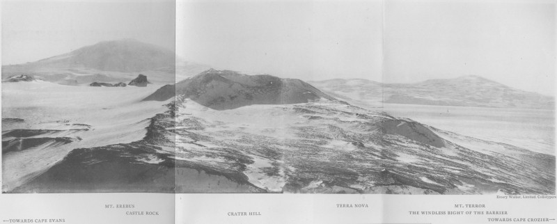A panoramic photograph of Ross Island half-covered in snow.