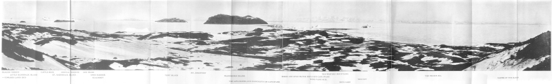 A panoramic photograph of Cape Evans partly covered in snow.