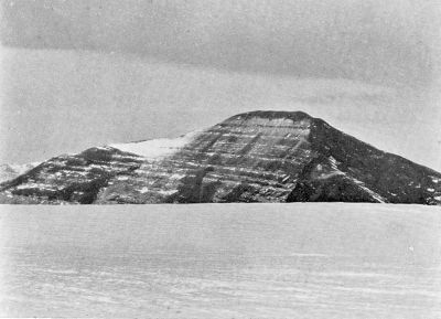 A photograph of a rocky island.