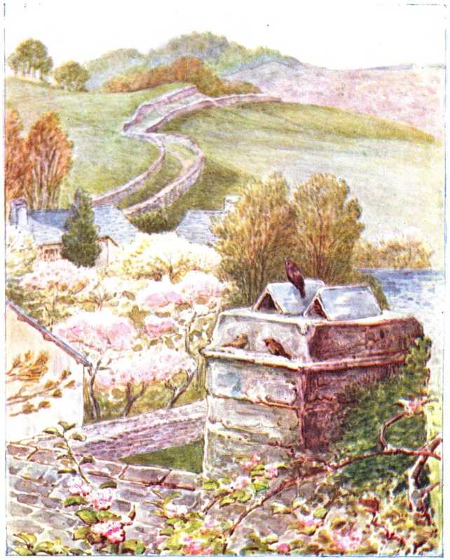 A chimney on which birds are sitting rises from the slate roof of a large house. In the distance, behind the gardens, a lane flanked with stone walls winds its way up the grassy hills.