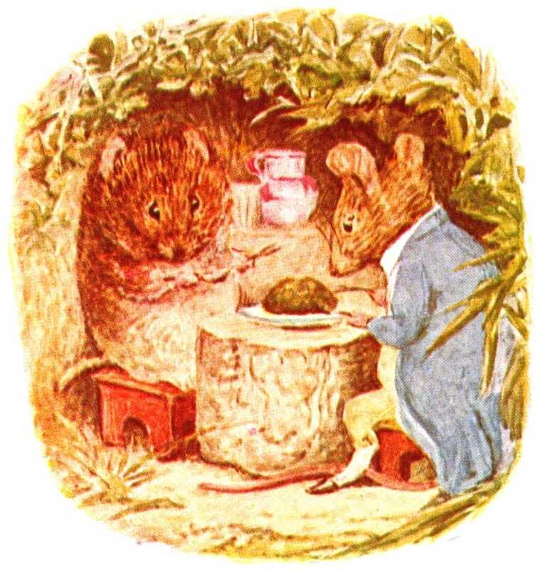 Timmy Willie and Johnny Town-mouse sit on little red stools in his burrow, holding knives and forks. In between them is a table made of a piece of branch, on which is a white plate with a herb pudding.
