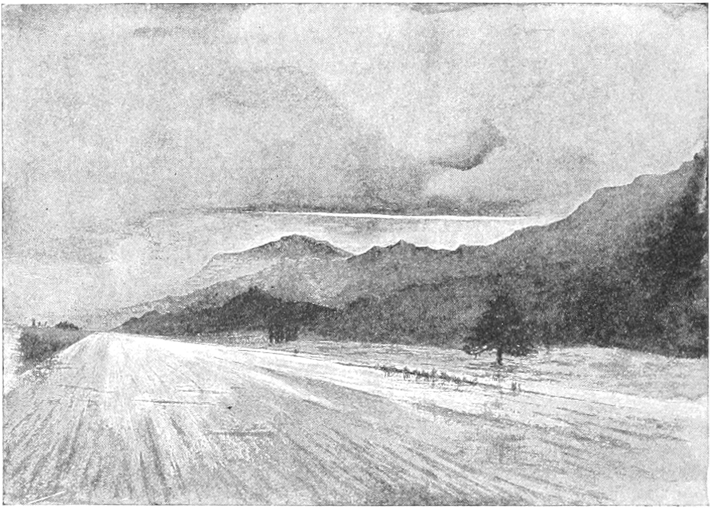 Sketch of a broad, flat road, with hills to the right and the sky above. A few trees are drawn along the right side of the road. The road has lighter areas of shading, which make it look like it is wet.